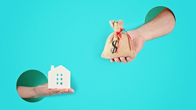 hands_holding_a_house_and_a_bag_of_money
